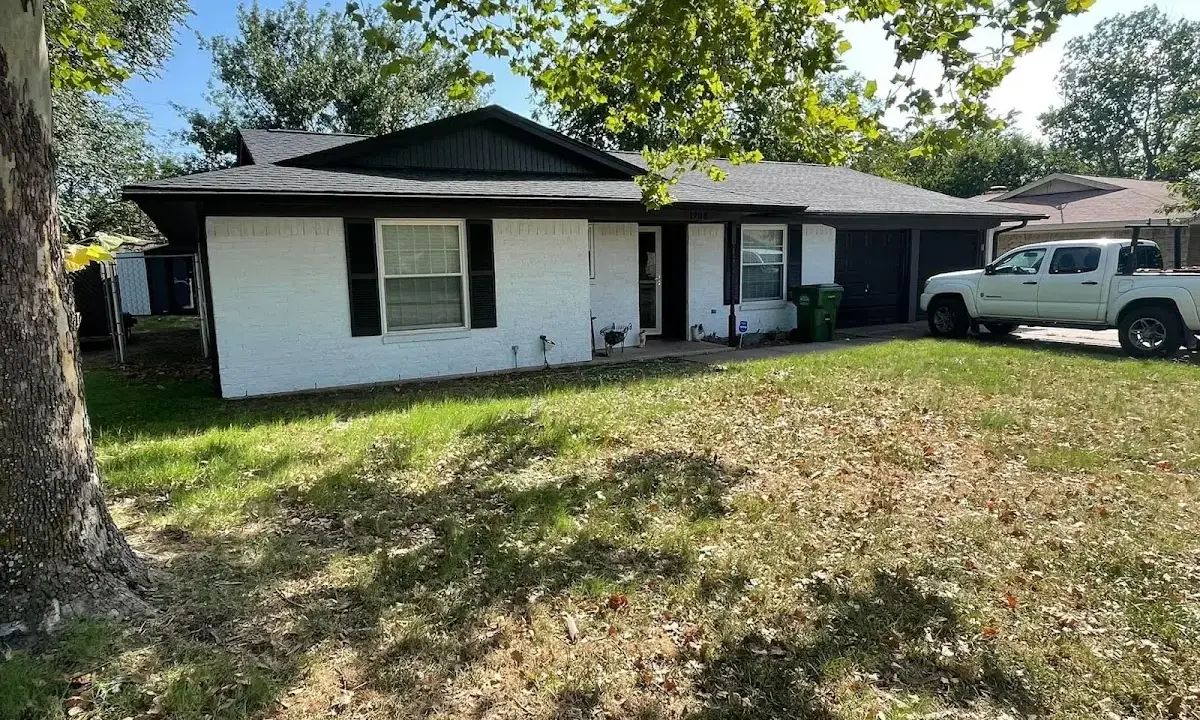 Professional roofing crew working on a residential roof in Pleasant Grove